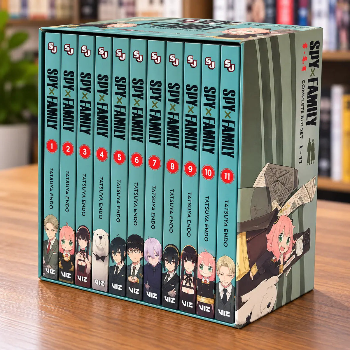 Spy x Family manga volumes 1 to 11 displayed together showing the matching teal spines and volume numbers