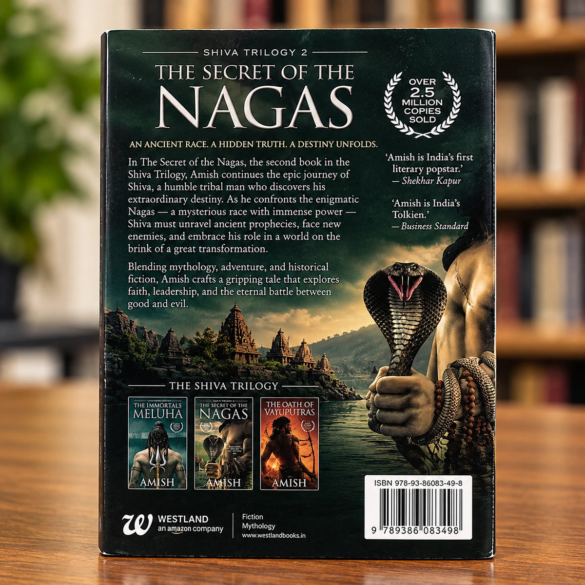 The Secret of the Nagas Book 2 by Amish Tripathi showing the Shiva Trilogy cover artwork and naga-themed design